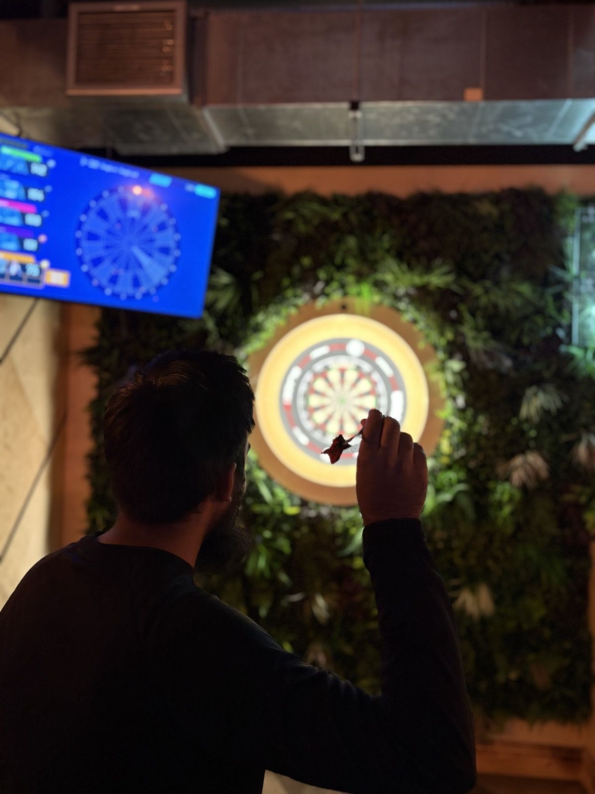A game of darts at a brothers' social