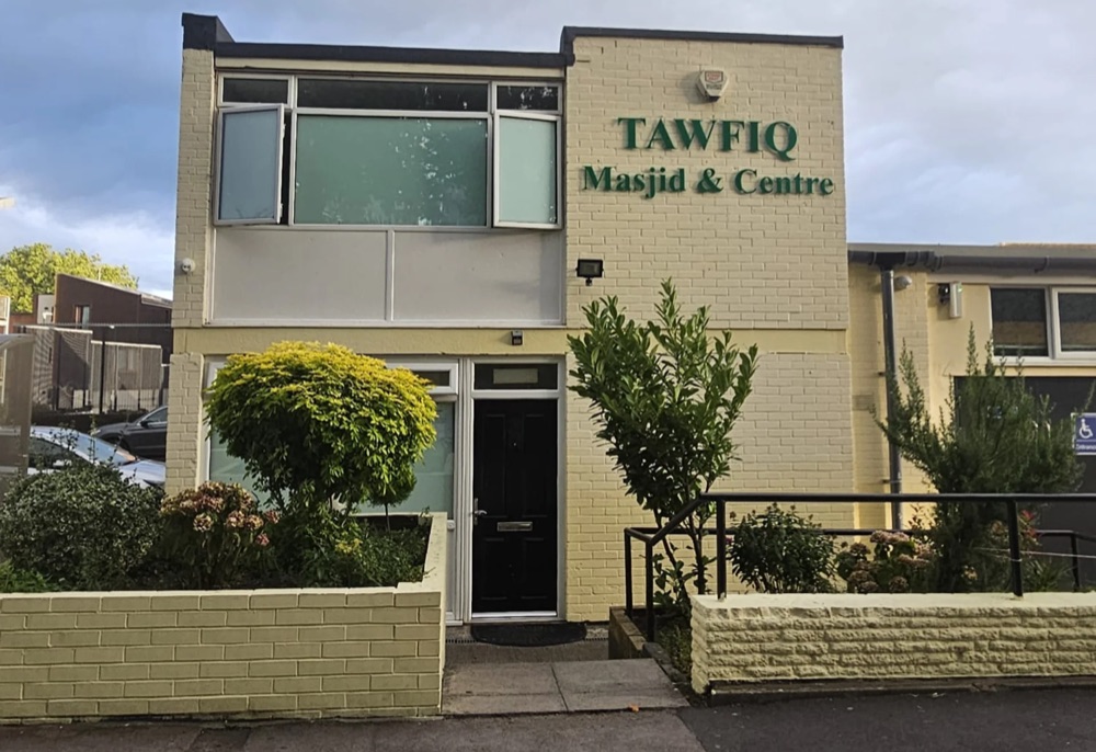 Tawfiq Masjid and Centre on Aiken Street, a cream brick building with green lettering above the door