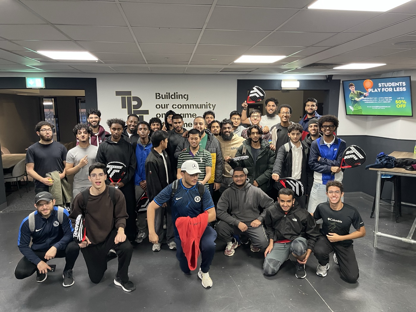 A big group photo after padel at Freshers